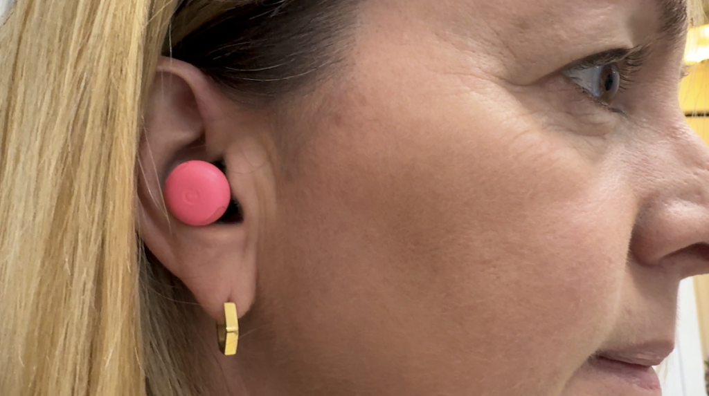 Side of Erin's face showing one Pixel Bud Pro 2 in her ear.